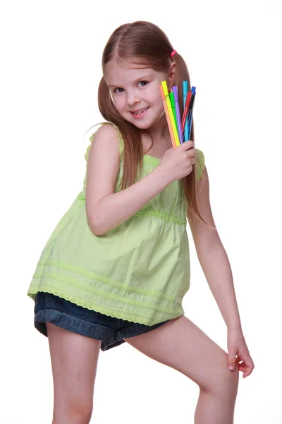 Studio portrait of little girl with felt-tip pens — Stock Photo, Image