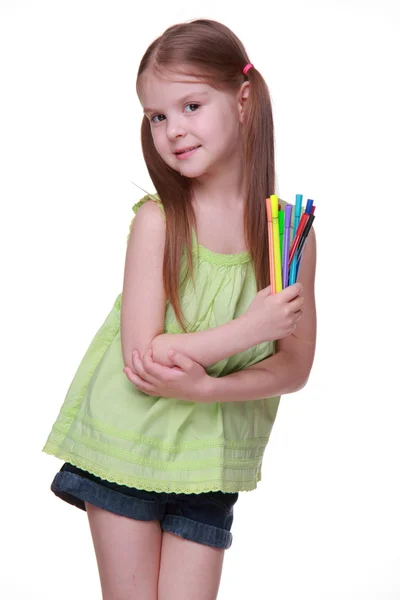 Studio portrait of little girl with felt-tip pens — Stock Photo, Image