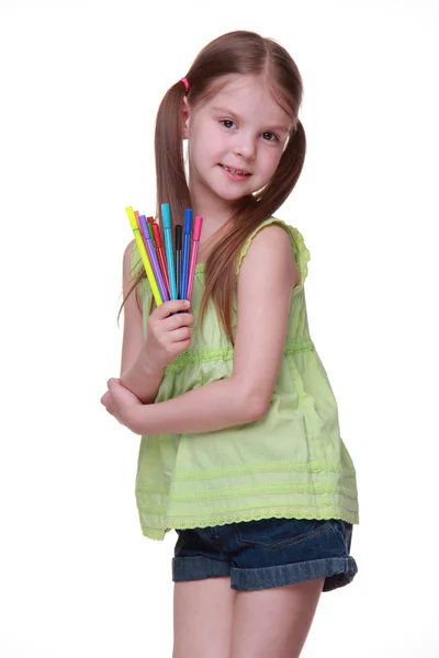 Studio portrait of little girl with felt-tip pens — Stock Photo, Image