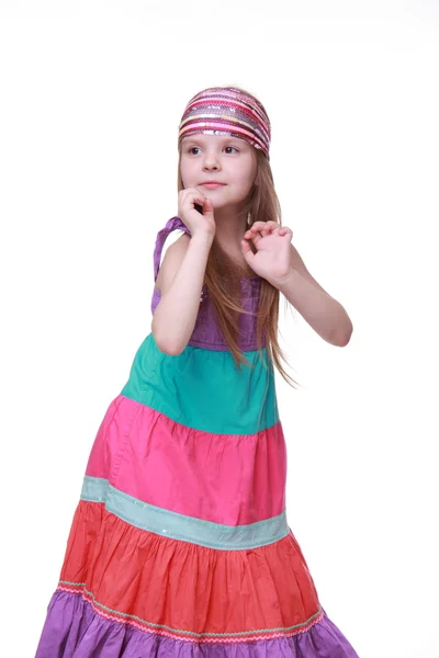 Niña en un precioso vestido colorido bailando en el estudio — Foto de Stock