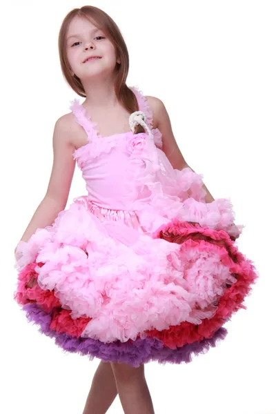 Beautiful little girl in a lovely pink dress isolated on a white background — Stock Photo, Image