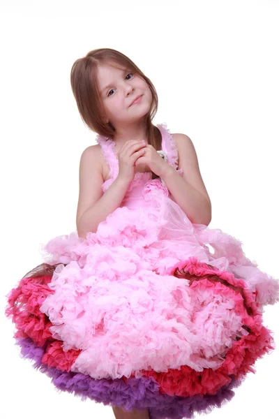 Beautiful little girl in a lovely pink dress isolated on a white background — Stock Photo, Image