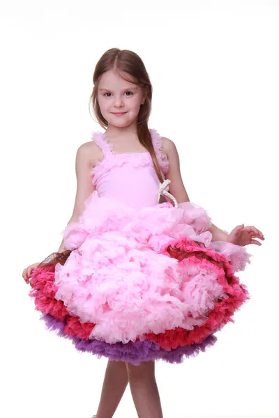 Beautiful little girl in a lovely pink dress isolated on a white background — Stock Photo, Image