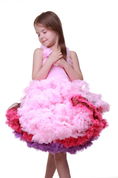 Beautiful little girl in a lovely pink dress isolated on a white background — Stock Photo, Image