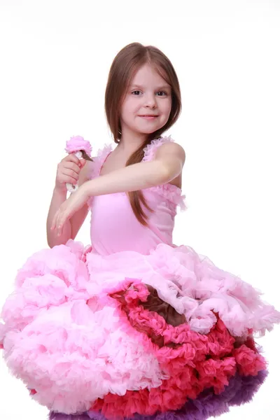 Little girl in a pink dress dancing isolated on a white background — Stock Photo, Image