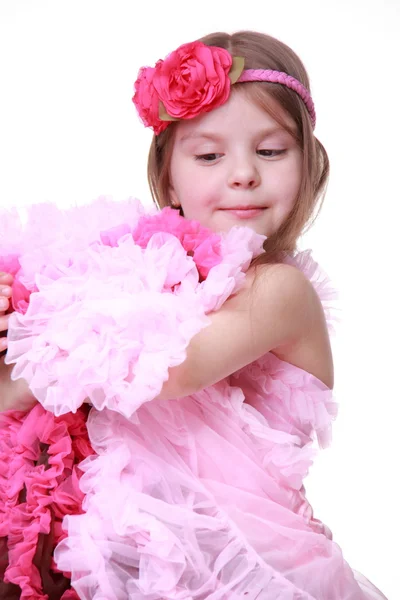 Portret van een klein meisje in een roze jurk — Stockfoto