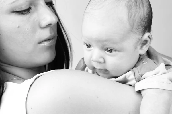 Black and White Art photo of beautiful mother holding baby boy — Stock Photo, Image