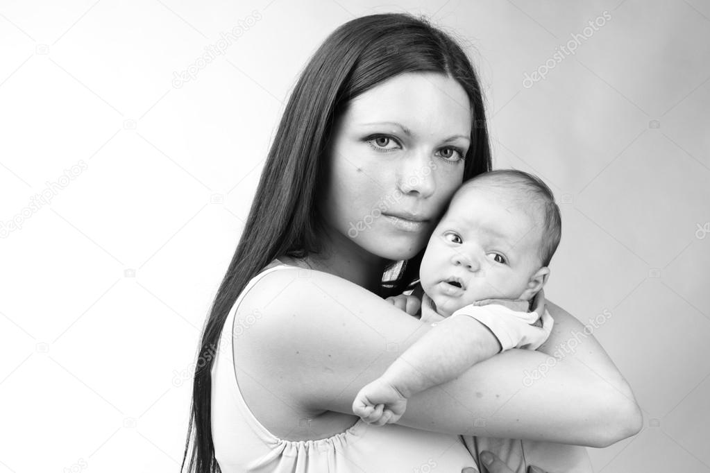 Black and White Art photo of beautiful mother holding baby boy, tender mother love