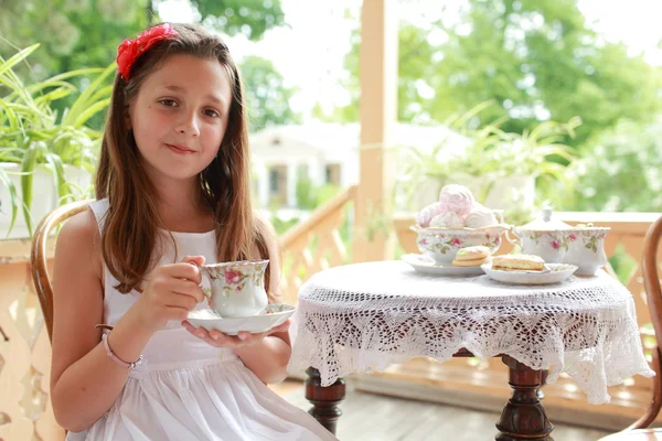 Outdoor image of beautiful little girls with tea — Stock Photo, Image