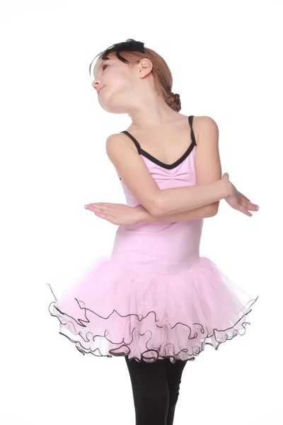 Studio immagine di un affascinante ballerino con bellissimi capelli in un tutù rosa sorridente e danzante su sfondo bianco — Foto Stock