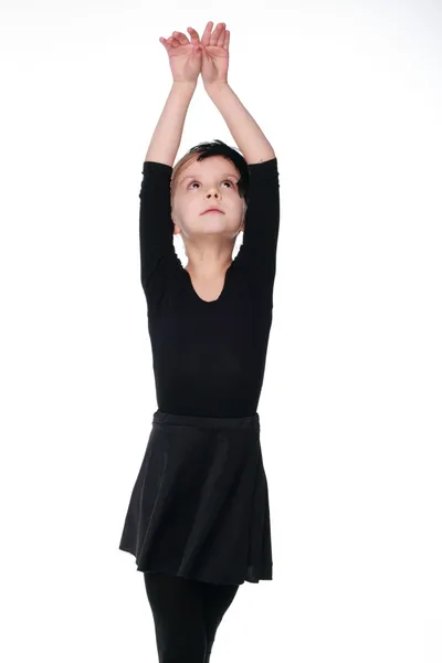 Pequeña bailarina emocional en tutú negro bailando como un remolino negro aislado sobre fondo blanco —  Fotos de Stock