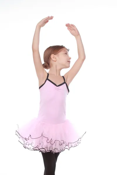 Young ballerina wearing lovely tutu dancing like a swangirl isolated over white background — Stock Photo, Image