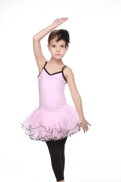 Young ballerina wearing lovely tutu dancing like a swangirl isolated over white background — Stock Photo, Image