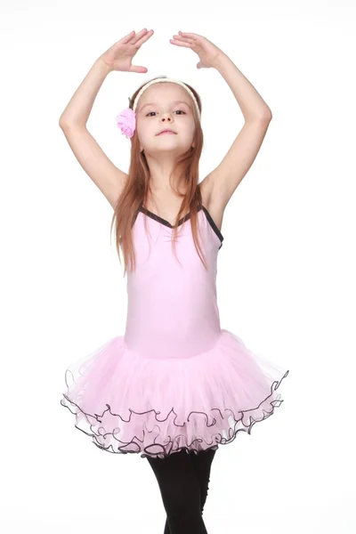 Young ballerina wearing lovely tutu dancing like a swangirl isolated over white background — Stock Photo, Image