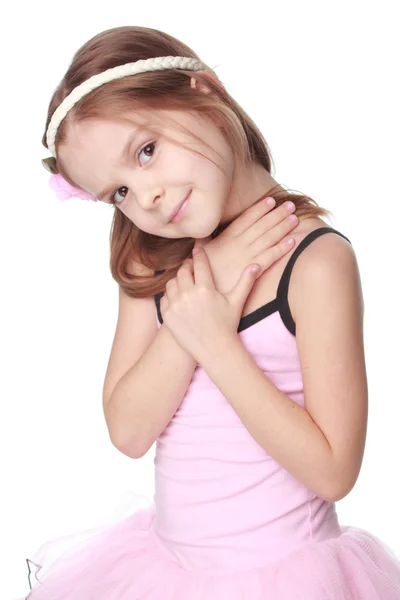 Alegre niña sonriente en un tutú bailando en blanco aislado en la belleza y la moda — Foto de Stock