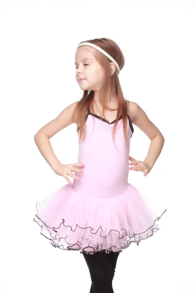 Studio portrait of a beautiful little ballerina in a pink tutu in dance pose on white background — Stock Photo, Image