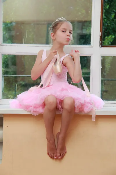 Beautiful little ballerina wearing tutu and posing on camera — Stock Photo, Image