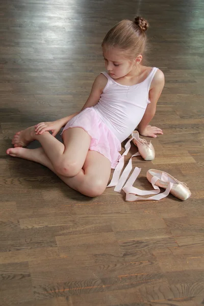 Beautiful little ballerina wearing tutu and posing on camera — Stock Photo, Image