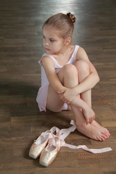 Beautiful little ballerina wearing tutu and posing on camera — Stock Photo, Image