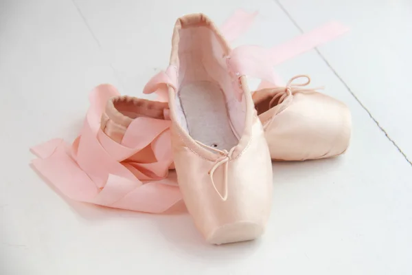 Pair of dainty pink ballet shoes — Stock Photo, Image