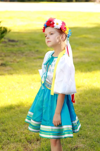 Charming young girl in a beautiful national costume of Ukraine outside — Stock Photo, Image