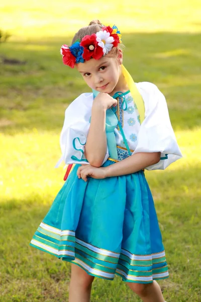 Charming young girl in a beautiful national costume of Ukraine outside — Stock Photo, Image