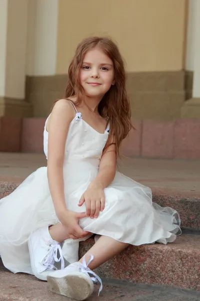 Little girls in white dresses with long hair outdoors — Stock Photo, Image