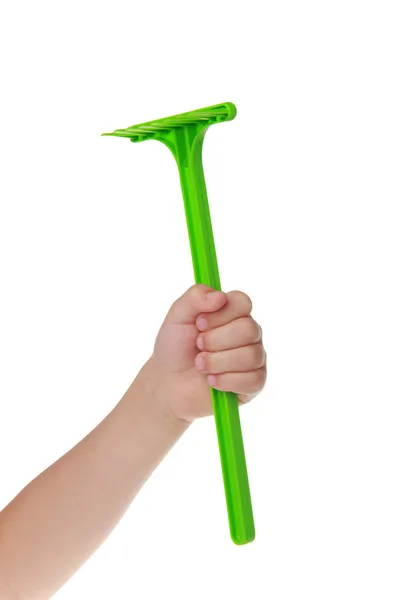 Игрушечно-зеленая лопата на белом фоне — стоковое фото