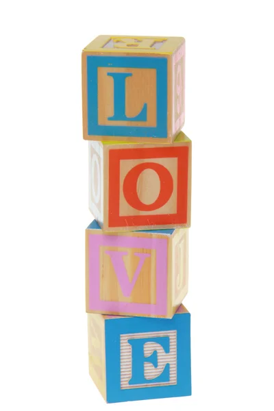 Lphabet leksak byggstenar stavning ordet älskar — Stockfoto