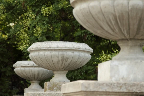 Old stone vase stands on the railing of the stairs — Stock Photo, Image