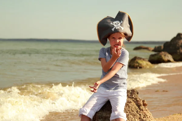 Angry young pirate girl on the background of a beautiful of a sea landscape — Stock Photo, Image