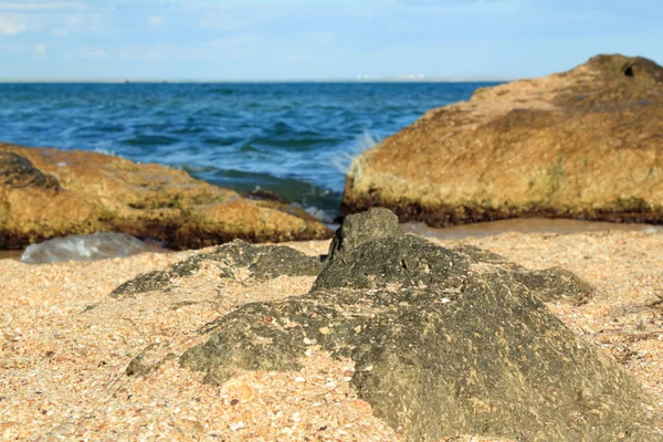 Beautiful sea coast with sand and stones — Stock Photo, Image