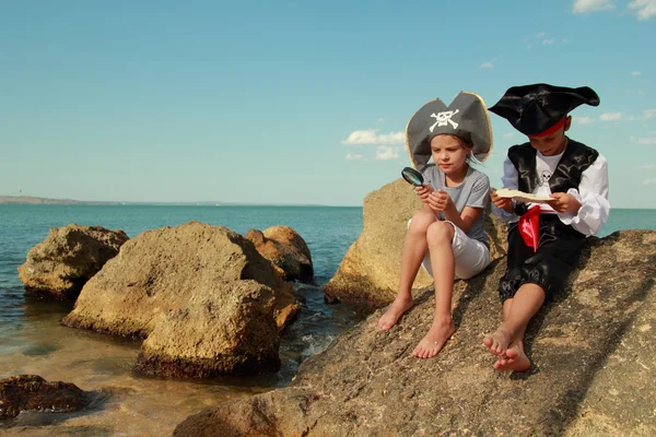 Joyful little girl and boy in fancy dress pirate Stock Picture