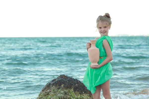 Little Greek goddess on the beach. — Stock Photo, Image