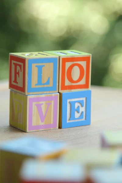 Word love from children's wooden blocks. Educational toys — Stock Photo, Image