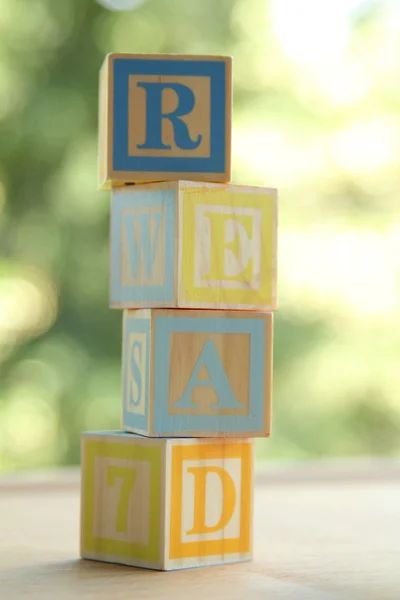Alphabet for easy learning at a young age. Kids wooden blocks spelling — Stock Photo, Image