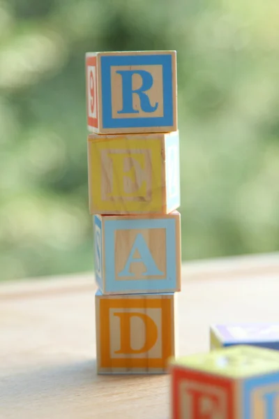 Alphabet for easy learning at a young age. Kids wooden blocks spelling — Stock Photo, Image