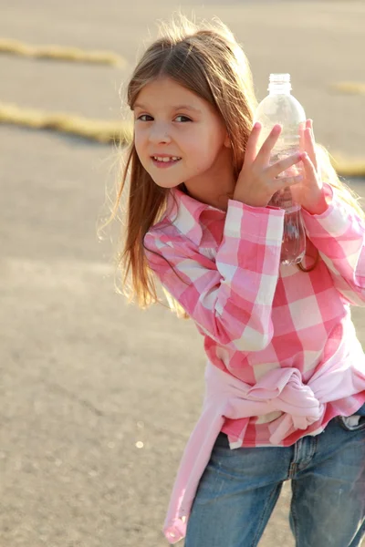 Cute little girl drinks water — Stock Photo, Image