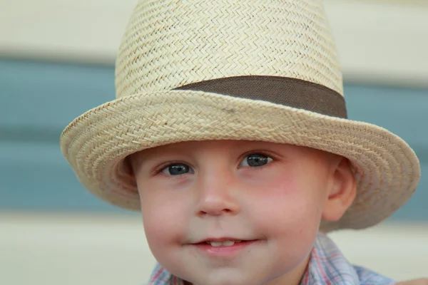 Beautiful little boy in a summer hat — Stock Photo, Image