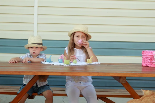 Brother and sister playing with toys — Stock Photo, Image