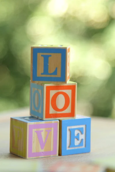 Kids wooden blocks spelling — Stock Photo, Image