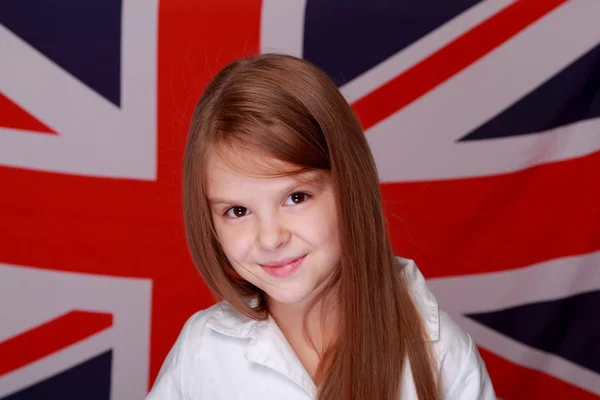 Girl on the background of the flag of Great Britain — Stock Photo, Image