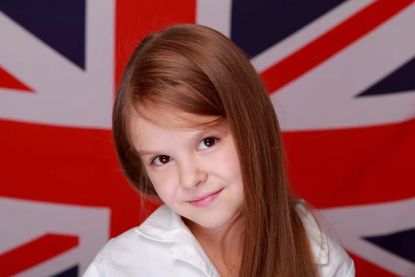 Girl on the background of the flag of Great Britain — Stock Photo, Image