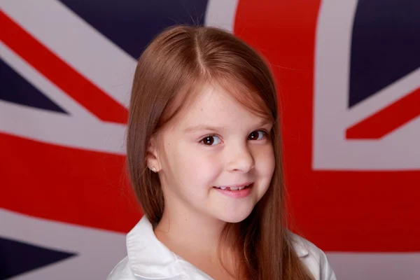 Dívka na pozadí vlajka Velké Británie — Stock fotografie
