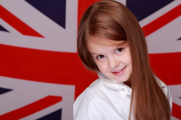 Menina no fundo da bandeira da Grã-Bretanha — Fotografia de Stock