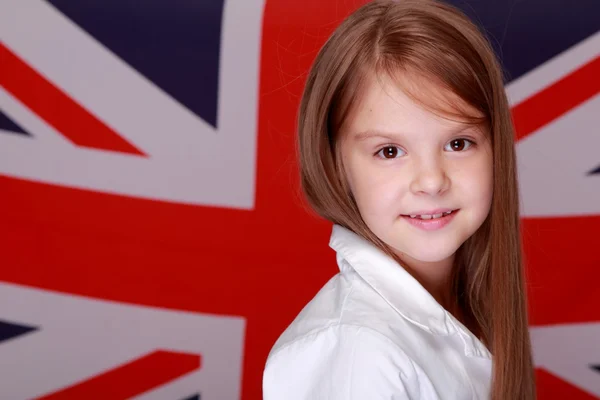 Menina no fundo da bandeira da Grã-Bretanha — Fotografia de Stock