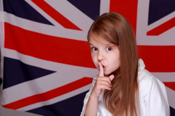 Дівчина на тлі прапор Великої Британії — стокове фото