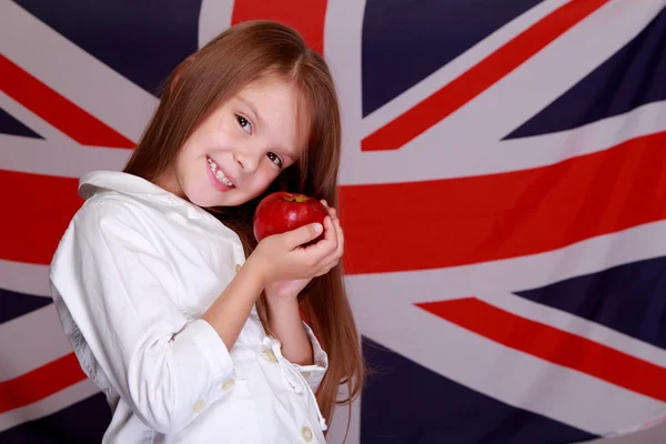 Menina no fundo da bandeira Reino Unido — Fotografia de Stock