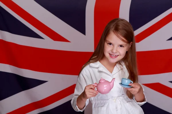 Girl on a background of the flag UK — Stock Photo, Image