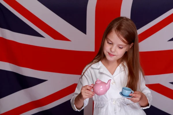 Girl on a background of the flag UK — Stock Photo, Image